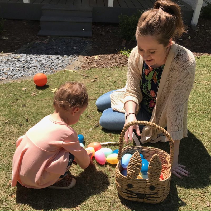 woman with child and easter eggs