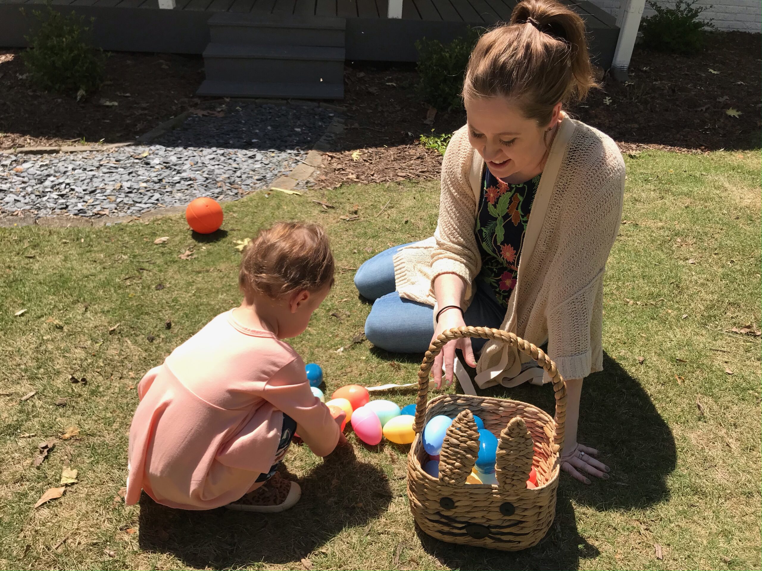 woman with child and easter eggs